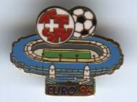 [Swiss badge]